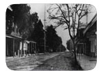Street Scene On First St. (Often Vcalled Main) Looking South, The Capitol Hotel On The Left With The Cupalo. The Dixon Pharmacy And G.E. Schulze Jeweler On The Right Puts This Photo Circa 1895. Gus Schulze Was In That Location From 1892 To 1913 When He Built Across The Street On The Casey Lot.